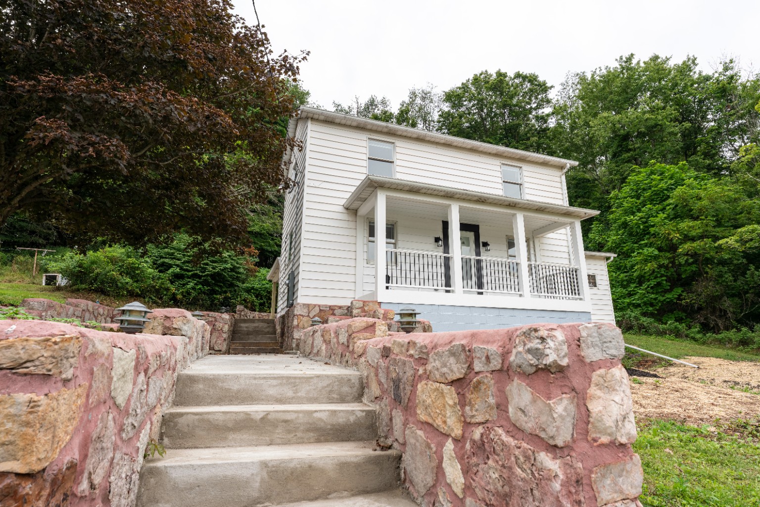 Covered front porch and entry of the Hoffman Hollow home